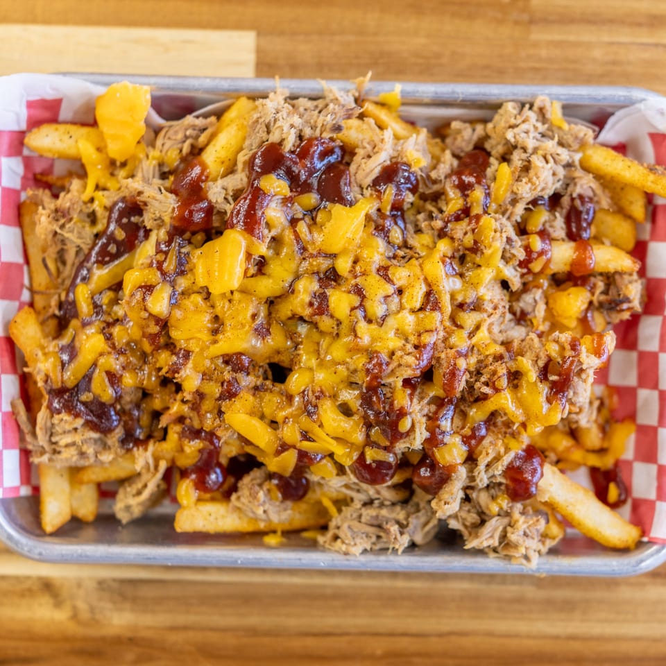 Dave's BBQ & Smokehouse pulled pork loaded fries with melted cheese and barbecue sauce.