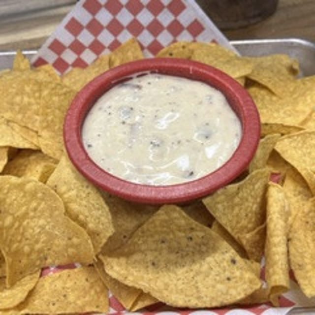 Brisket Queso Dip with Tortilla Chips.